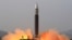 This picture released from North Korea's official Korean Central News Agency (KCNA) shows the test launch of what state media calls a new type inter-continental ballistic missile (ICBM), the Hwasongpho-17 from an undisclosed location in North Korea, March 24, 2022.