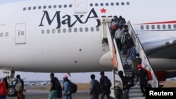 Nigerian students arrive at the Nnamdi Azikiwe International Airport from Ukraine after fleeing the invasion by Russia, in Abuja, March 4, 2022.