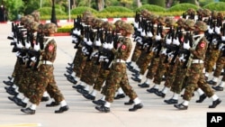 FILE - Members of the Myanmar military march during a parade in Naypyitaw, Myanmar, March 27, 2022. ASEAN foreign ministers issued their final communique Aug. 5, 2022, criticizing fellow member Myanmar for its lack of progress in ending the violence there. 