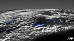 This image released by NASA/Johns Hopkins University Applied Physics Laboratory/Southwest Research Institute on March 29, 2022, shows a perspective view of Pluto's icy volcanic region. The surface and atmospheric hazes of Pluto are shown here in grayscale.