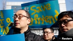 FILE - Activists attend a rally held to demand China not to send a group of North Korean defectors back to the North, near the Chinese embassy in Seoul, February 18, 2012. 