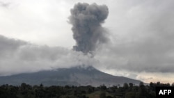 Mount Sinabung spews thick smoke in Karo, North Sumatra, Aug. 17, 2020. In addition to the volcano, two earthquakes struck off Indonesia's Sumatra island early Wednesday.