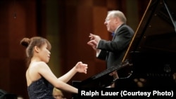 Rachel Cheung of Hong Kong performs with conductor Nicholas McGegan and the Fort Worth Symphony Orchestra on Sunday in the Semifinal Round at the 15th Van Cliburn International Piano Competition.