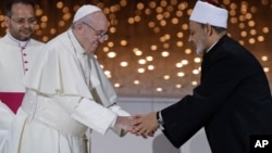 Pope Francis greets Sheikh Ahmed el-Tayeb, the grand imam of Egypt's Al-Azhar, after an Interreligious meeting at the Founder's Memorial in Abu Dhabi, United Arab Emirates, Feb. 4, 2019.