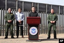 Customs and Border Protection Commissioner Kevin McAleenan (C) announced that the Trump administration will temporarily reassign several hundred border inspectors during a news conference at the border in El Paso, Texas, March 27, 2019.