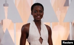 Actress Lupita Nyong'o wears a Calvin Klein gown and Chopard diamonds as she arrives at the 87th Academy Awards in Hollywood, California, Feb. 22, 2015.