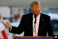 Republican presidential hopeful, Donald Trump holds a plane-side rally in a hanger at Youngstown-Warren Regional Airport in Vienna, Ohio, March 14, 2016.