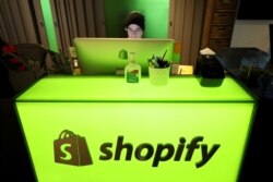 FILE PHOTO: An employee works at Shopify's headquarters in Ottawa, Ontario, Canada, Oct. 22, 2018.