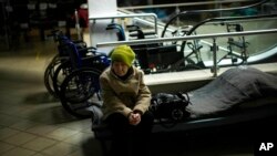 Lyudmyla Doroshenko rests in a reception center for displaced people in Dnipro, Ukraine, April 28, 2022.