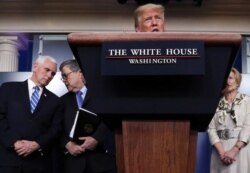 President Donald Trump, with ‪Vice President Mike Pence‬, Attorney General Bill Barr and White House Coronavirus response coordinator Dr. Deborah Birx, leads the daily coronavirus response briefing at the White House, March 23, 2020.