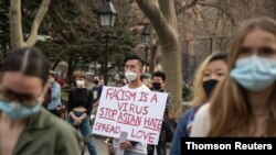 File - People participate during a Woman in solidarity march for Asian Women in Manhattan, New York, March 27, 2021.