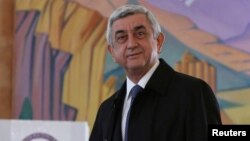 FILE - Armenia's President Serzh Sarksyan casts his ballot during a parliamentary election at a poling station in Yerevan, Armenia, April 2, 2017. 