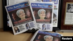FILE - The front cover of the Arab American News with the lead story on the electoral voice of Arabs and Muslims in Michigan is seen in the newspaper's office in Dearborn, Michigan, Sept. 18, 2024.