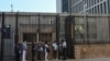 FILE - People queue at the US embassy in Havana, Cuba on May 3, 2022, as the consulate resumed issuing some immigrant visa services.
