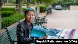 Author and illustrator, Lisa Changadveja shares her book, " Chang's First Songkran ", at Wat Padhammachart La Puente, CA. April 2022.