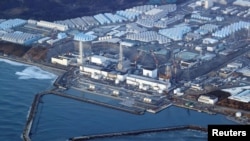 FILE - An aerial view shows the Fukushima Daiichi nuclear power plant following a strong earthquake, in Okuma town, Fukushima prefecture, Japan in this photo taken by Kyodo on March 17, 2022. (Kyodo/via Reuters) 