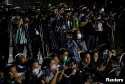 Journalists wearing masks wait for Thai citizens evacuated from Wuhan at U-Tapao Airport, in Rayong, Thailand February 4, 2020. REUTERS