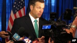 Kansas Secretary of State Kris Kobach speaks to supporters in launching his campaign for the Republican nomination for governor, June 8, 2017, at an events center in Lenexa, Kansas. 
