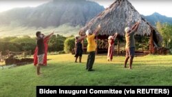 People participate in a Hawaiian chant in a virtual parade on Inauguration Day from Hawaii in this still image from video January 20, 2021. 