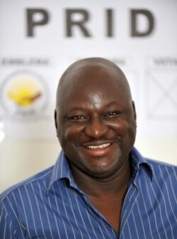 FILE - Aristide Gomes, speaks to journalists, Nov. 13, 2008, at his party's headquarters in Bissau.