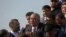 FILE - Gen. Abdul Rashid Dostum, center, and members of his entourage disembark on arrival at Kabul International Airport in Kabul, Afghanistan, July 22, 2018. 