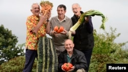 In this 2013 photo, these men pose with their prize-winning vegetables.
