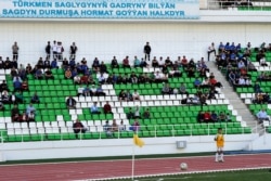 Football supporters attend the Turkmenistan national football championship match between Altyn Asyr and Kopetdag on April 19, 2020, amid the COVID-19 pandemic caused by the novel coronavirus.