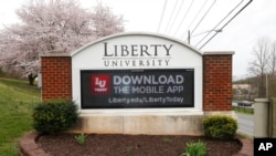 FILE - This March 24, 2020, photo shows an entrance to Liberty University in Lynchburg, Va.