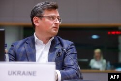 FILE - Ukraine Foreign Minister Dmytro Kuleba sits at EU headquarters in Brussels on May 16, 2022. On Tuesday he urged other governments to send weapons to aid Ukraine’s fight against Russian forces.