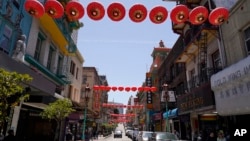 Lanterns hang in Chinatown above Grant Avenue in San Francisco, Monday, May 23, 2022. (AP Photo/Eric Risberg)