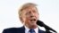 FILE PHOTO: Former U.S. President Donald Trump speaks during a rally to boost Ohio Republican candidates ahead of their May 3 primary election, at the county fairgrounds in Delaware, Ohio, April 23, 2022.