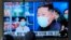 FILE - People in Seoul, South Korea, watch a TV showing North Korean leader Kim Jong Un, on May 16, 2022, as an illness suspected to be COVID-19 sickens hundreds of thousands of North Koreans.