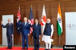 资料照：在日本出席印太地区安全四方机制会谈的美日印澳四国领导人。左一为澳大利亚总理阿尔巴尼斯。（2022年5月24日）