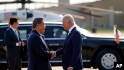 South Korean Foreign Minister Park Jin greets US President Joe Biden as he arrives at Osan Air Base, May 20, 2022, in Pyeongtaek, South Korea.