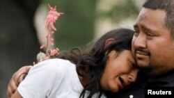 People react outside the Ssgt Willie de Leon Civic Center, where students had been transported from Robb Elementary School after a shooting, in Uvalde, Texas, U.S. May 24, 2022.