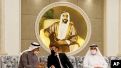 Newly-elected president of the United Arab Emirates Sheikh Mohammed bin Zayed Al Nahyan meets French President Emmanuel Macron, center, to mourn the death of Sheikh Khalifa Bin Zayed Al Nahyan at Al Mushrif Palace in Abu Dhabi, May 15. 2022.