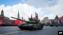 Russian tanks roll during the Victory Day military parade in Moscow, Russia, Monday, May 9, 2022, marking the 77th anniversary of the end of World War II. (AP Photo/Alexander Zemlianichenko)