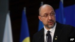 FILE - Ukraine Prime Minister Denys Shmyhal attends a press conference after a donor conference for his country in Warsaw, Poland, May 5, 2022. In recent meetings, Ukraine has secured promises of another $5 billion in aid.