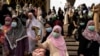 FILE - Muslims celebrate Eid al-Fitr, the Muslim festival marking the end of the holy fasting month of Ramadan, at the Thai Islamic Center amid the spread of the coronavirus disease (COVID-19) outbreak in Bangkok, Thailand, May 24, 2020. 