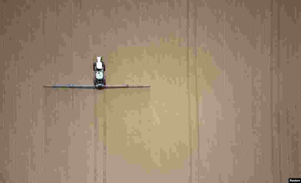 A Swiss farmer works in his field with his tractor in Sullens, Switzerland.