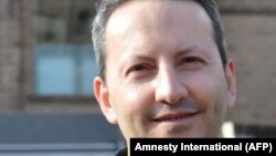 This handout photo released by NGO Amnesty International on May 19, 2022, shows Ahmadreza Djalali, an Iranian-Swedish citizen, at an undisclosed location. 