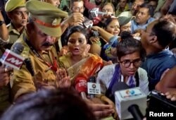 Rakhi Singh, Sita Sahu and Laxmi Devi, three of the five petitioners who filed a plea to pray every day before the idol of a goddess and relics inside the Gyanvapi mosque, speak with the media after they leave the mosque in Varanasi, India, May 14, 2022.