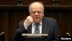 FILE - Then-speaker of the Belarusian parliament Stanislav Shushkevich addresses a session of the Polish parliament during a visit to Warsaw, Feb. 25, 2011.