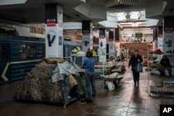 Residents live in a subway station still used as temporary shelter in Kharkiv, eastern Ukraine, Tuesday, May 24, 2022. (AP Photo/Bernat Armangue)