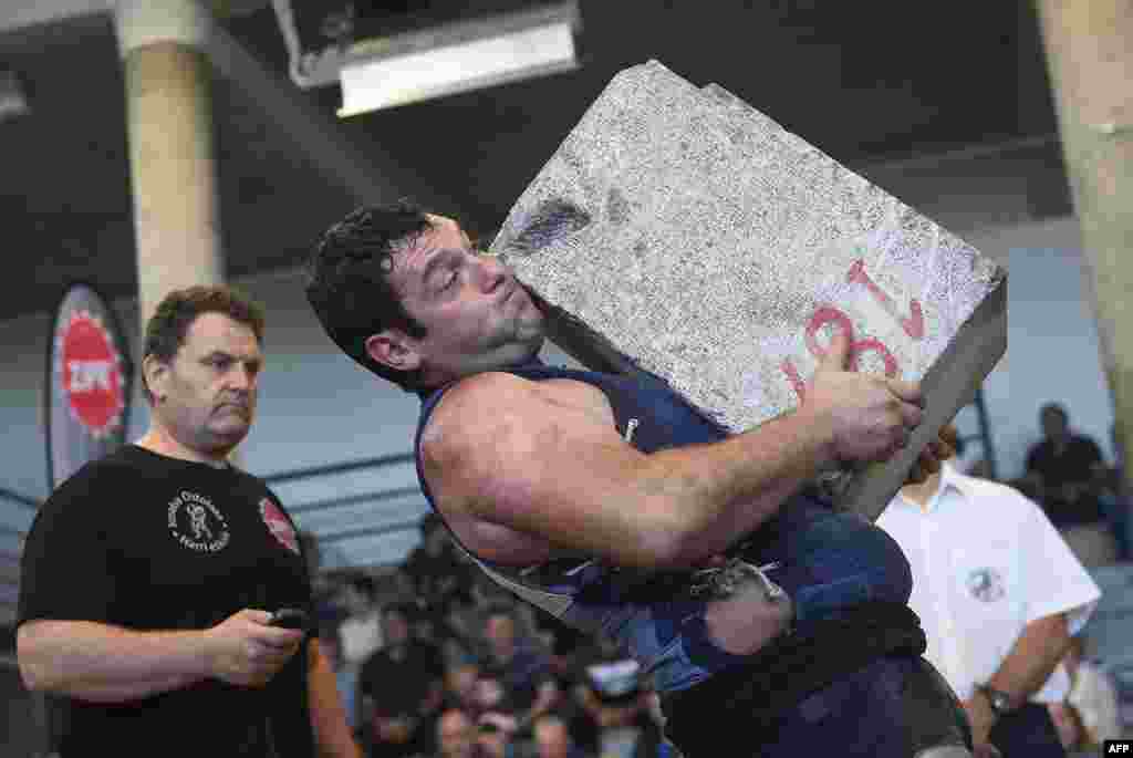 Basque &quot;Harrijasotzaile&quot; stone lifter Jokin Eizmendi breaks his record lifting 12 different ancient stones in 9:17 minutes in the Spanish Basque village of Aia, Spain.