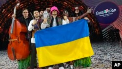 Members of the Kalush Orchestra from Ukraine celebrate after winning the Grand Final of the Eurovision Song Contest, at Palaolimpico arena, in Turin, Italy, May 14, 2022.