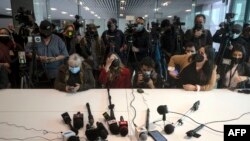 Journalists demanding justice and a stop to the murders of reporters following the murder of Mexican photojournalist Margarito Martinez, wait for Baja California State Prosecutor Hiram Sanchez at the State Prosecutors' Office in Tijuana, Baja California State on Jan. 18, 2022.