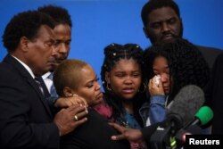 Family members of Ruth Whitfield, who was killed during a shooting at a Tops supermarket, attend a news conference with Attorney Ben Crump in Buffalo, New York, May 16, 2022.
