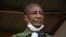FILE - Guinea's then-President Alpha Conde addresses his supporters during a campaign rally in Kissidougou, Oct. 12, 2020.