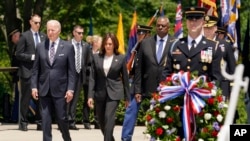 President Joe Biden arrives with Vice President Kamala Harris and Defense Secretary Lloyd Austin to lay a wreath at The Tomb of the Unknown Soldier at Arlington National Cemetery on Memorial Day, May 30, 2022, in Arlington, Virginia. 